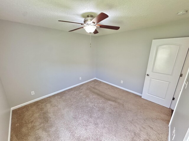 556 Cedar Lakes Dr, Little River, SC 29566 - spare room with a smoke detector, a textured ceiling, ceiling fan, and carpet