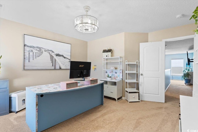 office area with light colored carpet, a notable chandelier, and a textured ceiling