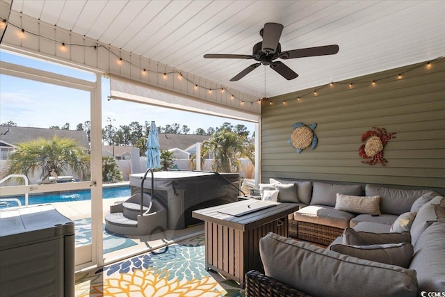 exterior space with a hot tub, a fenced in pool, a ceiling fan, fence, and outdoor lounge area