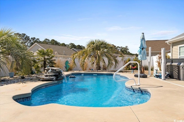 view of swimming pool featuring a patio area, a fenced backyard, and a fenced in pool