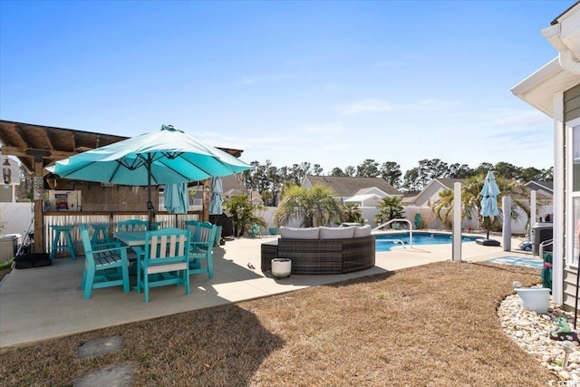 view of yard featuring a patio, a fenced backyard, an outdoor hangout area, a fenced in pool, and outdoor dining space