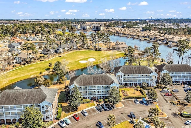 aerial view featuring a water view, golf course view, and a residential view