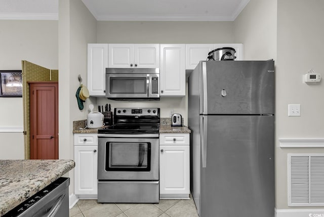kitchen featuring stainless steel appliances, visible vents, white cabinetry, and light stone counters