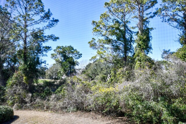 5801 Oyster Catcher Dr Unit 723, North Myrtle Beach, SC 29582 - view of community with volleyball court, fence, a tennis court, and a yard