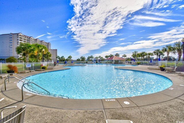 5801 Oyster Catcher Dr Unit 723, North Myrtle Beach, SC 29582 - community pool featuring fence and a patio
