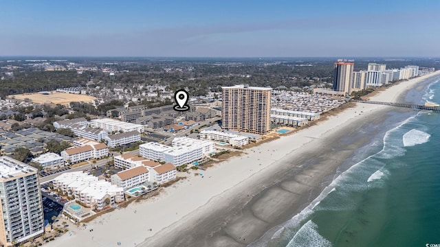 birds eye view of property with a view of the beach, a water view, and a view of city