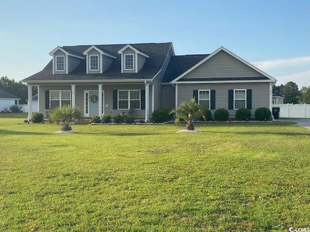 new england style home featuring a porch