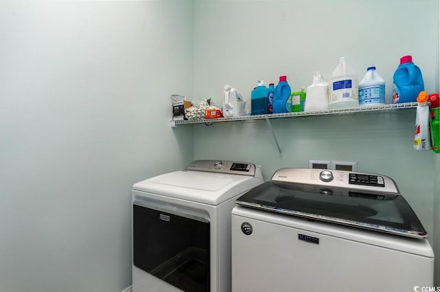 laundry room with independent washer and dryer