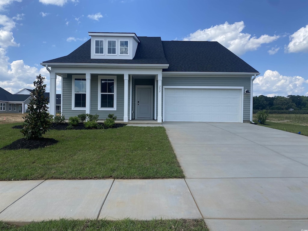 242 Letha Dr, Longs, SC 29568 - view of front of home with concrete driveway, a garage, a front lawn, covered porch, and a shingled roof