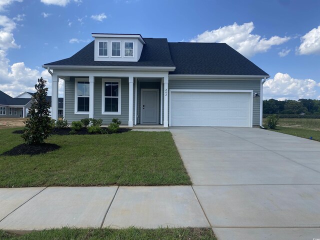 242 Letha Dr, Longs, SC 29568 - view of front of home with concrete driveway, a garage, a front lawn, covered porch, and a shingled roof
