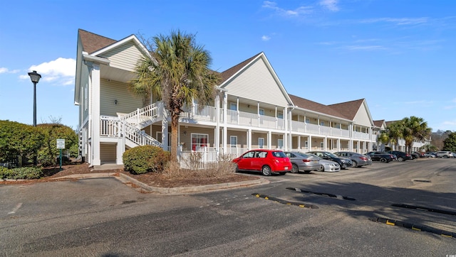 view of property featuring uncovered parking