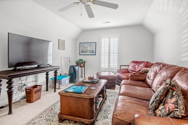 carpeted living room featuring lofted ceiling, a ceiling fan, and visible vents