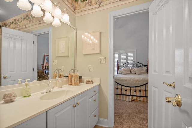 bathroom featuring ensuite bath and vanity