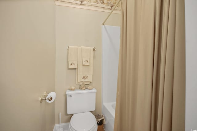 full bath with toilet and shower / bath combo