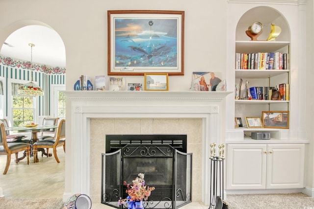 details with built in shelves and a fireplace