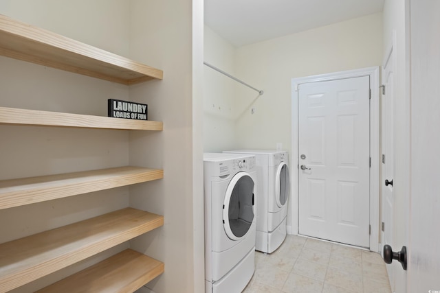 clothes washing area with laundry area and washing machine and clothes dryer