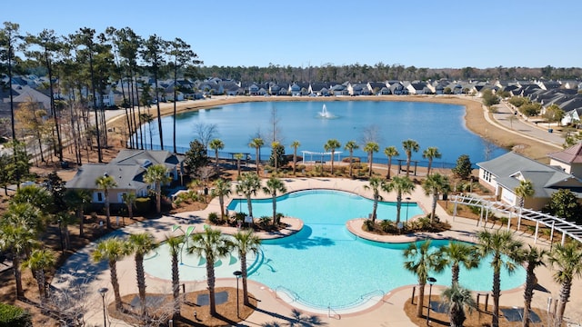 birds eye view of property featuring a water view and a residential view