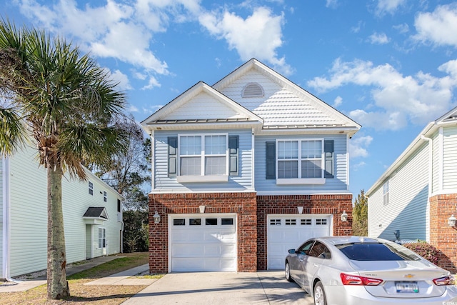 view of front facade featuring a garage, driveway, and brick siding