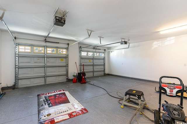 garage featuring baseboards and a garage door opener