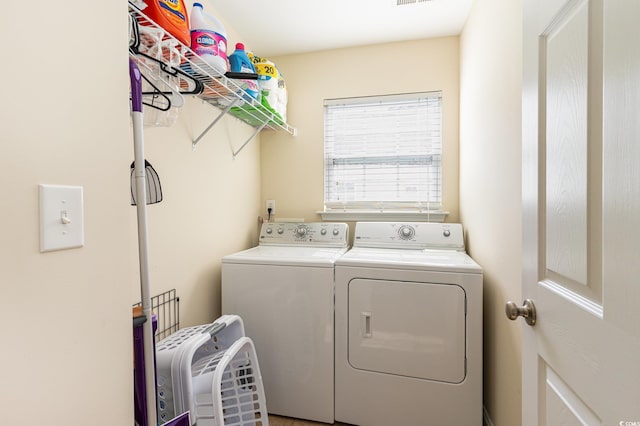 laundry room featuring laundry area and separate washer and dryer