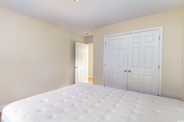 unfurnished bedroom with a closet