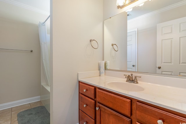 full bath with baseboards, vanity, ornamental molding, and tile patterned floors