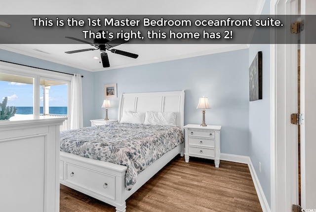 bedroom featuring a water view, wood finished floors, a ceiling fan, baseboards, and crown molding