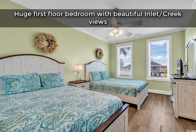 bedroom featuring baseboards, ornamental molding, ceiling fan, and wood finished floors