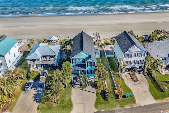 bird's eye view with a water view and a view of the beach