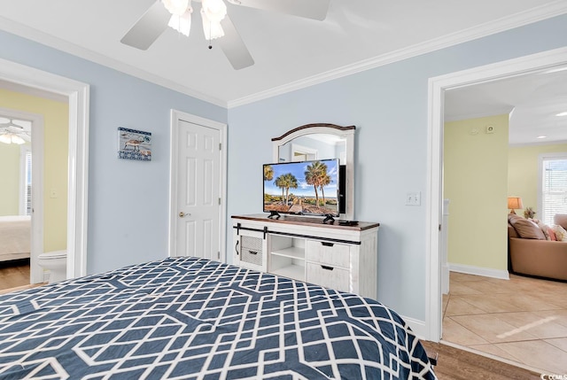 tiled bedroom featuring ceiling fan, baseboards, and crown molding