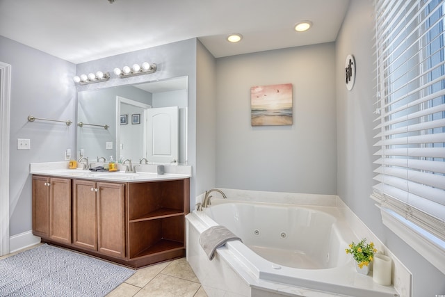 bathroom with a whirlpool tub, tile patterned flooring, double vanity, and a sink