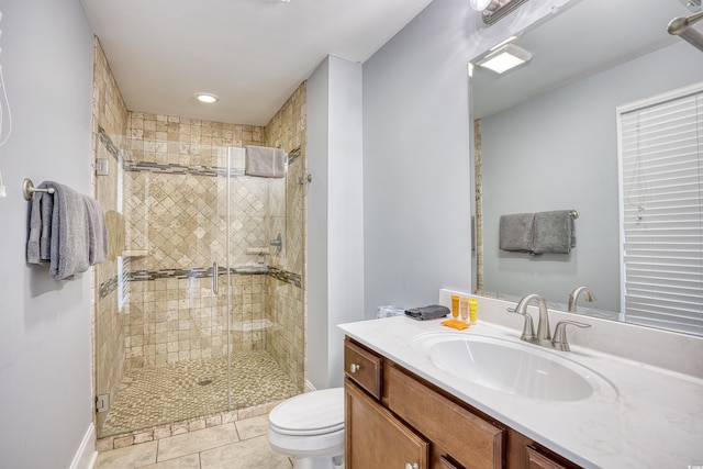 full bath with tile patterned flooring, a shower stall, toilet, and vanity