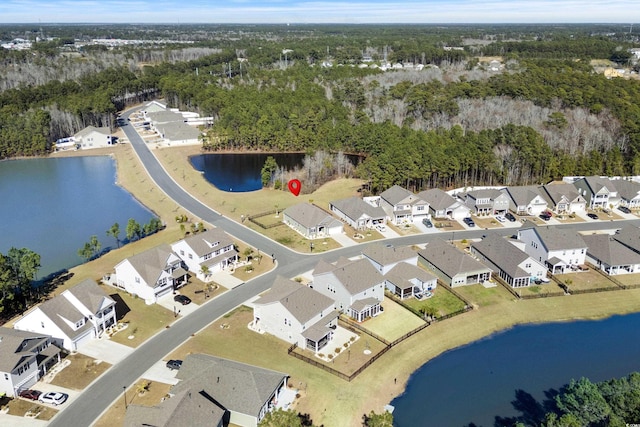 bird's eye view with a residential view and a water view