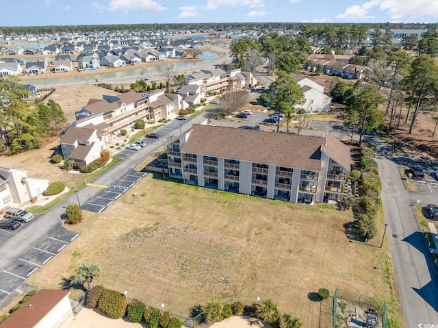 birds eye view of property with a residential view