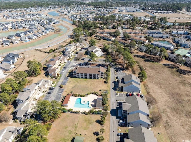 birds eye view of property with a residential view