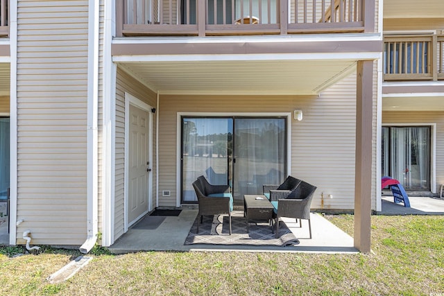 view of patio featuring a balcony