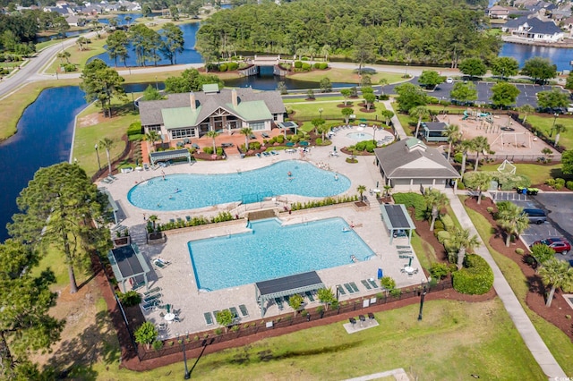 drone / aerial view with a water view and a residential view