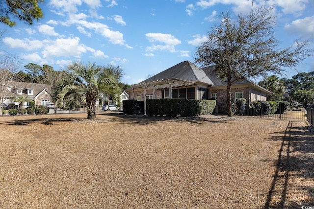 view of property exterior with brick siding and fence