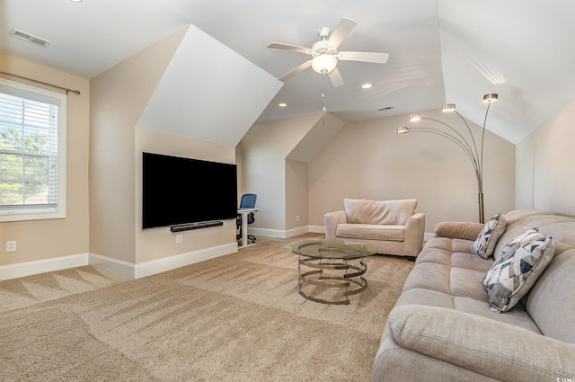 carpeted living room featuring lofted ceiling, visible vents, ceiling fan, and baseboards