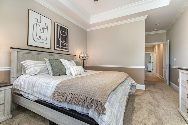 bedroom featuring light carpet, baseboards, and crown molding