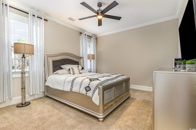 bedroom with light carpet, visible vents, baseboards, ceiling fan, and ornamental molding