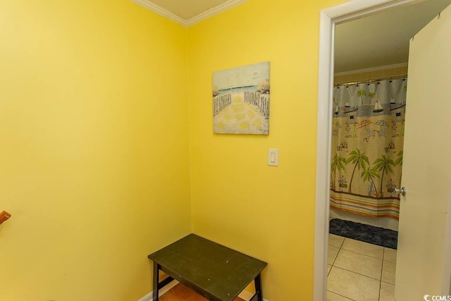 corridor featuring ornamental molding and tile patterned flooring