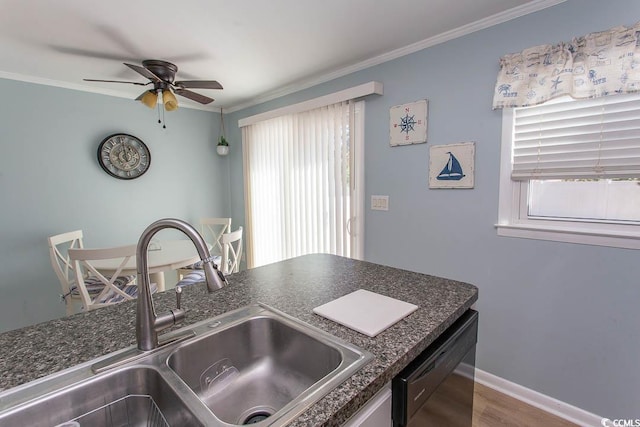 kitchen featuring ornamental molding, black dishwasher, and a sink