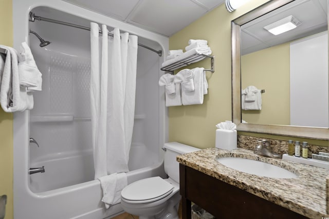 bathroom with visible vents, vanity, shower / bath combo with shower curtain, and toilet