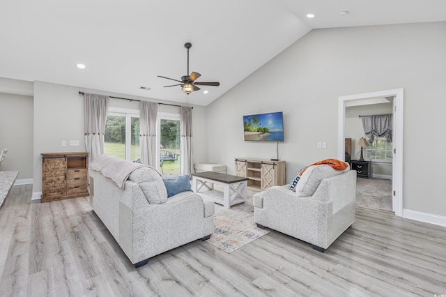 living area with baseboards, ceiling fan, visible vents, and light wood-style floors