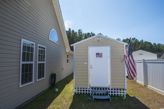 view of shed with fence