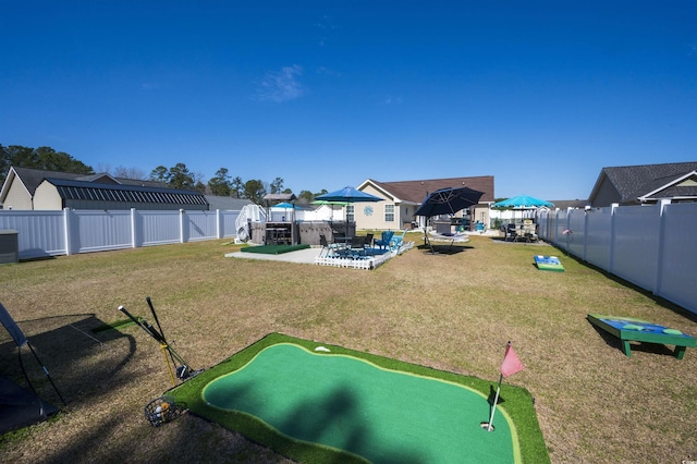 exterior space featuring a patio, a yard, and a fenced backyard