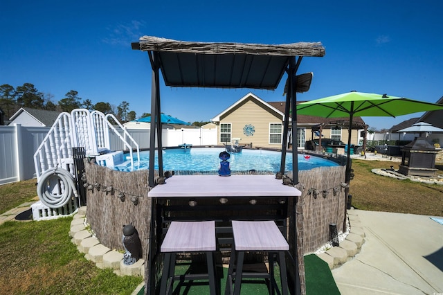 exterior space with a fenced in pool and a fenced backyard