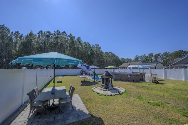 view of yard featuring a fenced in pool, a patio, outdoor dining area, and a fenced backyard