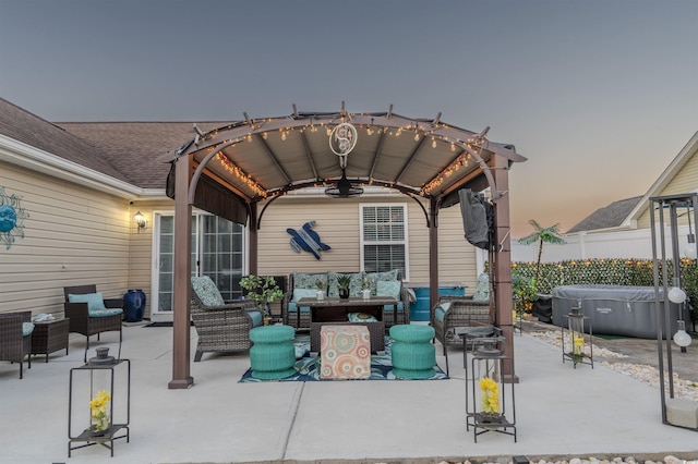 view of patio with fence, a hot tub, outdoor lounge area, and a pergola